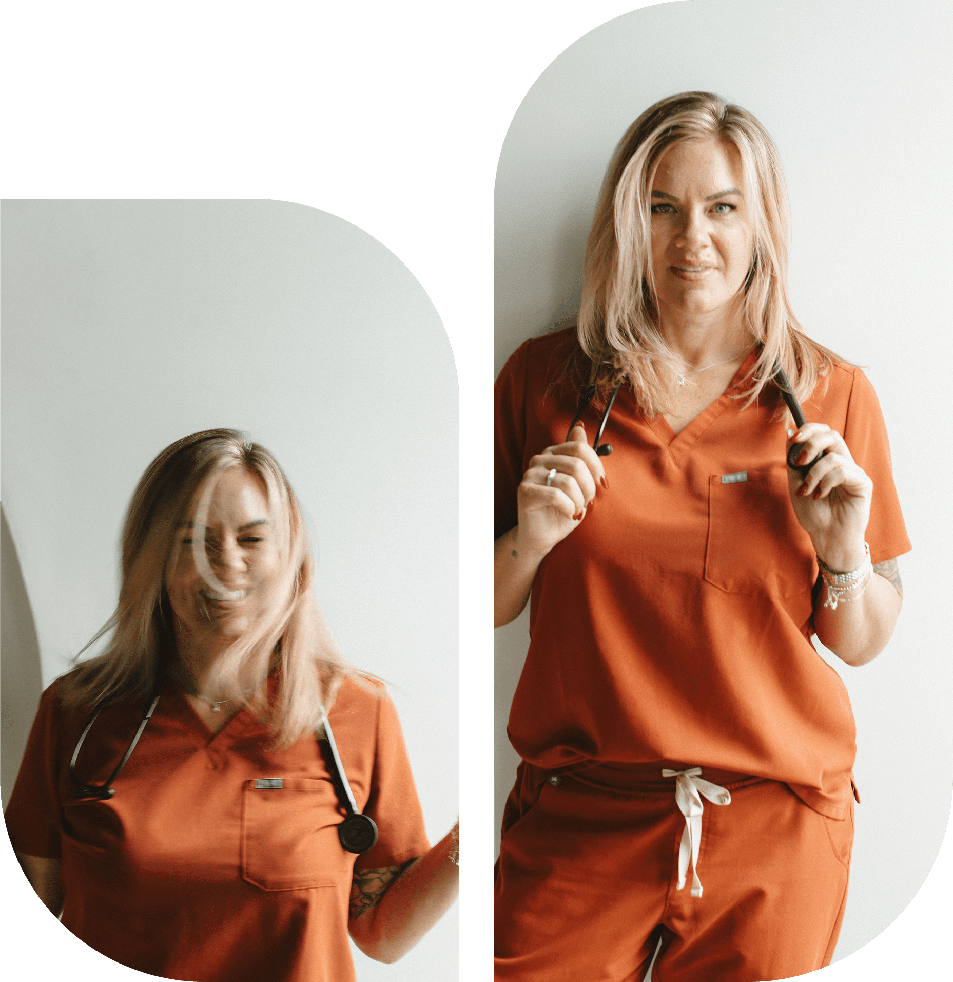 A woman in an orange outfit standing near a mirror, adjusting her hair.
